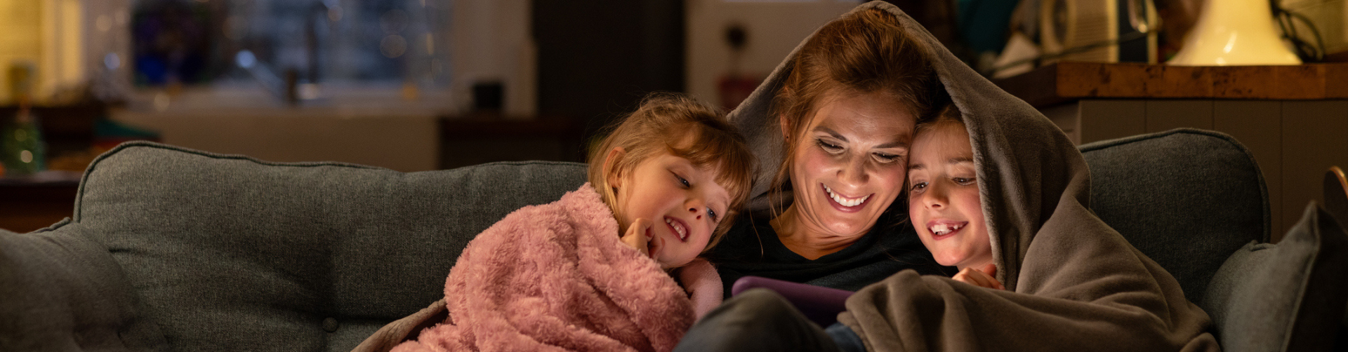 family relaxing on their couch